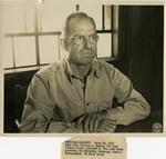 Brigadier General William A. Hagins seated at desk