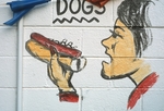 Woman eating hotdog